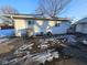 Rear view of house showing a partially snow covered patio at 3130 Chrysler St, Indianapolis, IN 46224