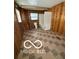 Simple bathroom with wood-paneled walls and a vintage toilet and bathtub at 340 W 11Th St, Anderson, IN 46016