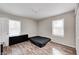 Bright bedroom with wood-look flooring and a window provides natural light at 3647 Richelieu Rd, Indianapolis, IN 46226