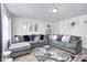 Comfortable living room featuring ample seating with stylish decor and large area rug at 3647 Richelieu Rd, Indianapolis, IN 46226