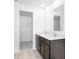 Stylish bathroom featuring double sinks, dark wood cabinetry, and a large mirror with ample counter space at 385 N Post Oak Dr, Mooresville, IN 46158