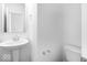Clean bathroom featuring a pedestal sink, mirror, and toilet with neutral finishes at 385 N Post Oak Dr, Mooresville, IN 46158