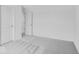 A spacious bedroom with neutral walls and plush gray carpeting throughout at 385 N Post Oak Dr, Mooresville, IN 46158