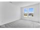 Bright bedroom featuring plush gray carpeting and double windows offering ample natural light at 385 N Post Oak Dr, Mooresville, IN 46158