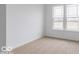 Well-lit bedroom with carpet flooring and large windows at 385 N Post Oak Dr, Mooresville, IN 46158