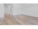 Bright, open-concept living room featuring hardwood floors and neutral wall paint at 385 N Post Oak Dr, Mooresville, IN 46158