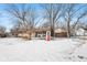 Spacious backyard, winter scene with playset and swingset at 3909 S Lasalle St, Indianapolis, IN 46237
