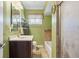 Clean bathroom with a bathtub, shower, and updated tile at 3909 S Lasalle St, Indianapolis, IN 46237