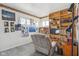 Bedroom with recliner, bookshelves, and a large TV at 3909 S Lasalle St, Indianapolis, IN 46237