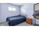 Small bedroom with a double bed and a wooden nightstand at 3909 S Lasalle St, Indianapolis, IN 46237