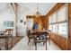 Bright dining area features a wood table with chairs and built-in wooden wall paneling at 3909 S Lasalle St, Indianapolis, IN 46237