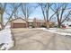 Brick ranch house with attached garage and a long driveway at 3909 S Lasalle St, Indianapolis, IN 46237
