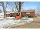 Ranch house with a red swing and basketball hoop in the yard at 3909 S Lasalle St, Indianapolis, IN 46237