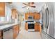 Spacious kitchen featuring stainless steel appliances and wood cabinets at 3909 S Lasalle St, Indianapolis, IN 46237