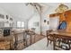 Cozy living room features a stone fireplace and adjacent dining area at 3909 S Lasalle St, Indianapolis, IN 46237