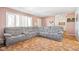 Spacious living room with gray sectional sofa at 3909 S Lasalle St, Indianapolis, IN 46237