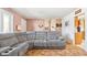 Living area with gray sectional and kitchen view at 3909 S Lasalle St, Indianapolis, IN 46237