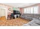 Living room with gray sectional sofa and large TV at 3909 S Lasalle St, Indianapolis, IN 46237