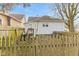 House backyard with wooden fence and access door at 44 W Adams St, Franklin, IN 46131