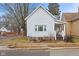 Quaint white house with a classic design and front porch at 44 W Adams St, Franklin, IN 46131