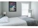 Bright bedroom with a queen-size bed and large window at 4521 Norwaldo Ave, Indianapolis, IN 46205