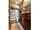 Bathroom with a shower, toilet, and wood vanity with ample counter space at 5419 E Shae Lake Dr, Mooresville, IN 46158