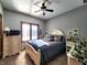 Charming bedroom with a beautiful bed frame, plenty of natural light, and ceiling fan at 5419 E Shae Lake Dr, Mooresville, IN 46158