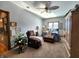 Spacious bedroom with a comfy recliner, large windows, and ample closet space at 5419 E Shae Lake Dr, Mooresville, IN 46158
