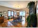 Bright dining room with hardwood floors, chandelier, and a large table at 5419 E Shae Lake Dr, Mooresville, IN 46158