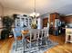 Charming dining area with light blue table and hutch at 5419 E Shae Lake Dr, Mooresville, IN 46158