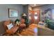 Bright entryway with hardwood floors and two orange armchairs at 5419 E Shae Lake Dr, Mooresville, IN 46158