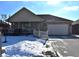 Brick ranch home with attached garage, porch, and snow-covered yard at 5419 E Shae Lake Dr, Mooresville, IN 46158