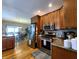 Modern kitchen with stainless steel appliances and oak cabinets at 5419 E Shae Lake Dr, Mooresville, IN 46158
