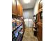 Well-equipped laundry room with washer, dryer, and ample storage at 5419 E Shae Lake Dr, Mooresville, IN 46158