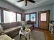 Sun-drenched living room with sectional sofa and hardwood floors, great for relaxing at 5419 E Shae Lake Dr, Mooresville, IN 46158