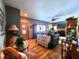 Spacious living room with hardwood floors, fireplace, and comfy seating at 5419 E Shae Lake Dr, Mooresville, IN 46158