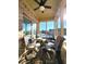 Relaxing screened porch with seating area and view of backyard at 5419 E Shae Lake Dr, Mooresville, IN 46158