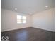 Bedroom featuring modern vinyl floors, recessed lighting and white walls bathed in natural light from a large window at 5592 Cattail Branch Ln, Clayton, IN 46118