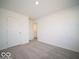 Bedroom featuring neutral carpet, white walls, and closet at 5592 Cattail Branch Ln, Clayton, IN 46118