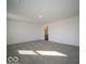 Large bedroom with carpet and view into ensuite bathroom at 5592 Cattail Branch Ln, Clayton, IN 46118