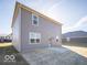 Two-story home featuring gray siding, a concrete patio, and a well-maintained lawn at 5592 Cattail Branch Ln, Clayton, IN 46118