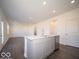 Kitchen island with stainless dishwasher in bright modern space at 5592 Cattail Branch Ln, Clayton, IN 46118