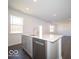 Kitchen island boasts a stainless dishwasher and sink at 5592 Cattail Branch Ln, Clayton, IN 46118