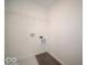 Laundry room with white walls, wood-look floor and hookups at 5592 Cattail Branch Ln, Clayton, IN 46118