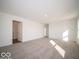 Spacious living room with neutral carpet and bright natural light at 5592 Cattail Branch Ln, Clayton, IN 46118