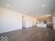 Spacious living room features recessed lighting and durable flooring at 5592 Cattail Branch Ln, Clayton, IN 46118