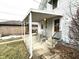 Covered patio with seating area adjacent to the house at 57 N 6Th Ave, Beech Grove, IN 46107