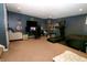 Finished basement with a home office and gym area at 6121 E Solitude Ct, Camby, IN 46113