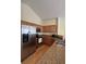 Modern kitchen with stainless steel appliances and wood cabinets at 706 Shagbark Ct, Plainfield, IN 46168