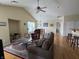 Open living room with hardwood floors, vaulted ceiling and comfy seating at 706 Shagbark Ct, Plainfield, IN 46168